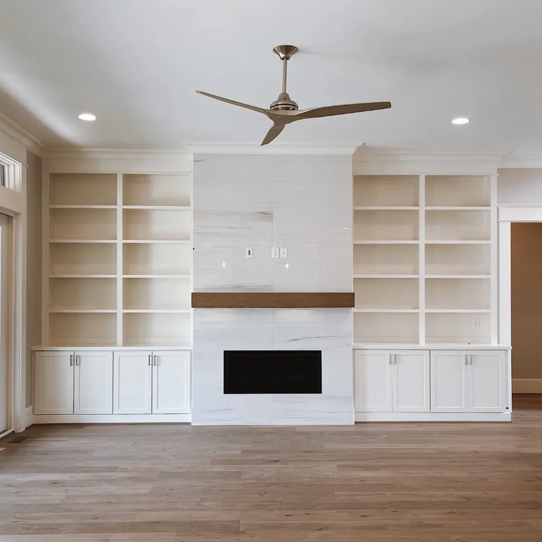 Basement Remodel Ideas for Marietta Homes — Finished basement with fireplace and built-in shelving