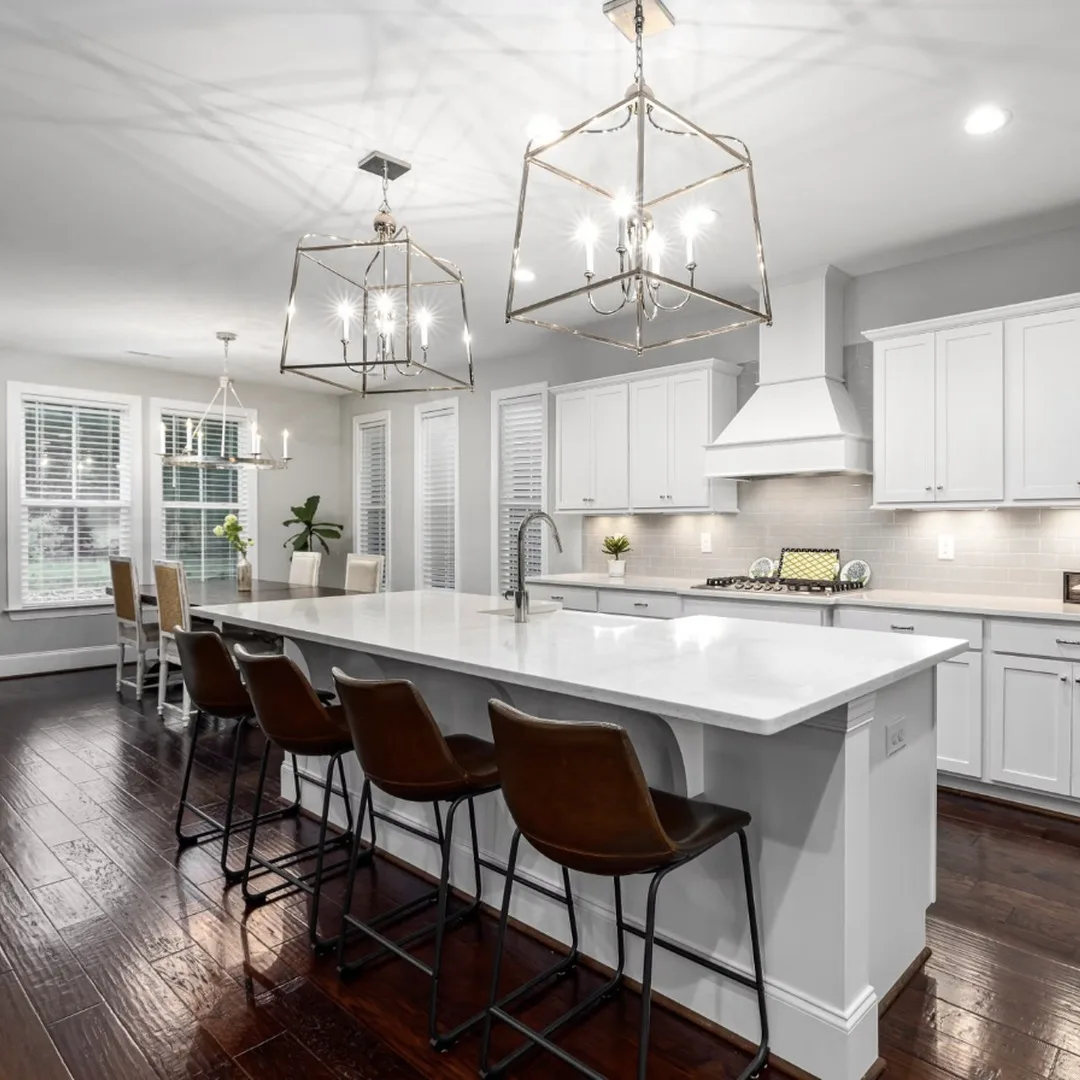 How Long Does a Kitchen Remodel Take in Kennesaw, GA — Remodeled white kitchen with island and new countertops